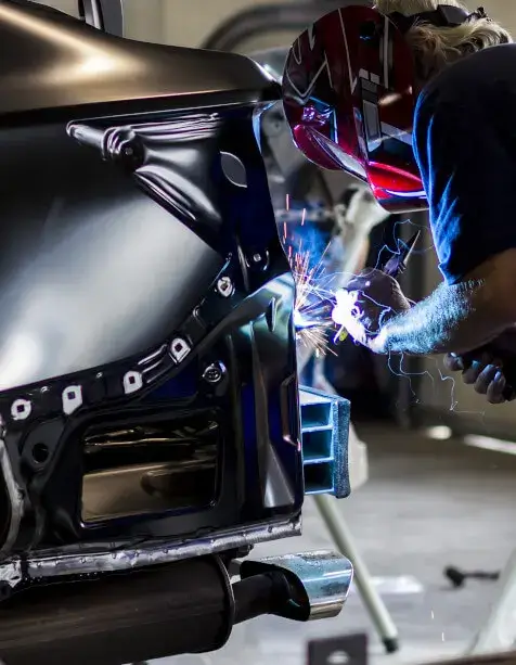 Auto Repair Technician Welding Vehicle
